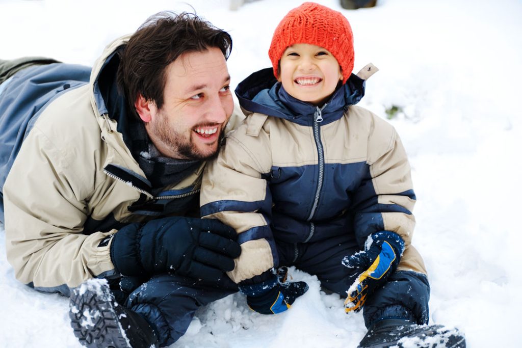 father and son in snow